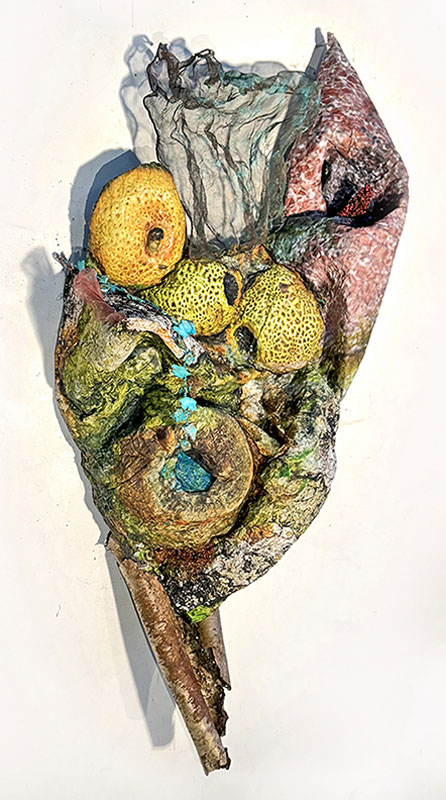  Corrosion of Society, mixed-media relief sculpture: Sculpted photo, aluminum, brass, patinated copper, stone plant, tree bark, and gauze, 54" x 24" x 12". 2026