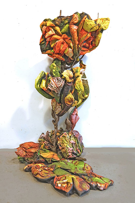 "Drawn to Danger", mixed-media relief, sculpted photo, aluminum, and wood, 72" x 24" x 48". 2024